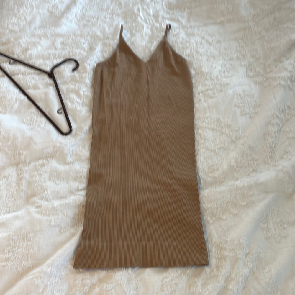 Nude skintight dress by Charlotte Russe size Large fits to body. Ribbed material